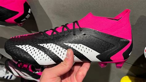 pink predator boots.